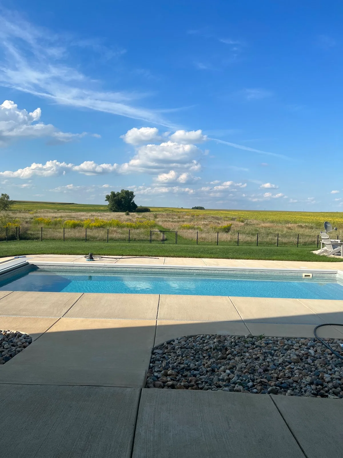 Inground pool kept clear and clean at a Custom Pools service customer's home