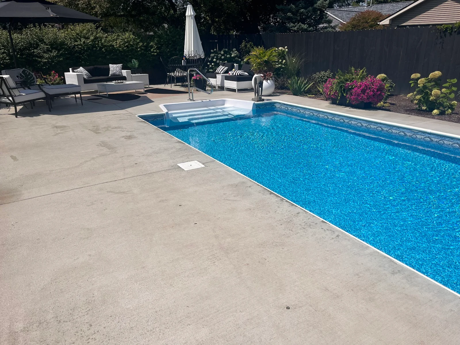 Pool and patio at a home where Custom Pools installed the heater and equipment